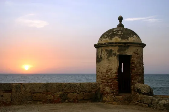 A colonial watchtower on the city walls of Cartagena, Colombia, at sunset