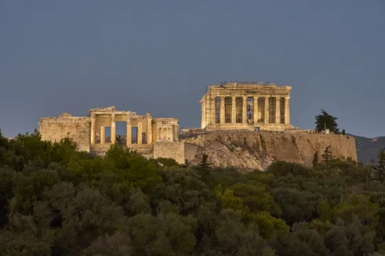 The Acropolis of Athens, including the Parthenon and Propylaea, lit at dusk