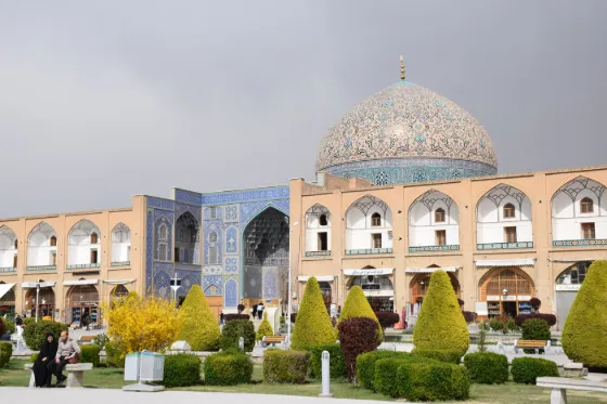 The tiled dome and arcaded facade of the Sheikh Lotfollah Mosque on Naqsh-e Jahan Square in Isfahan, Iran