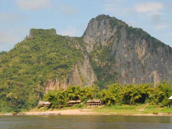 The Mekong River at Luang Prabang, Laos, with forested hills along the far bank