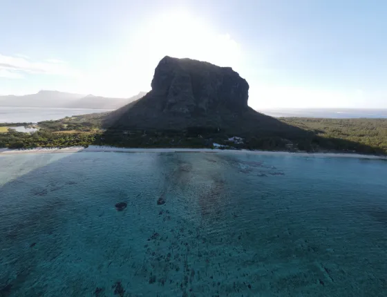The steep basalt dome of Le Morne Brabant rising above the lagoon in southwest Mauritius