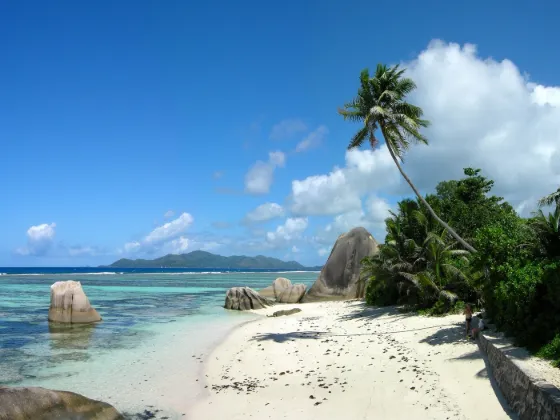 The pink granite boulders and turquoise water of Anse Source d'Argent beach on La Digue, Seychelles