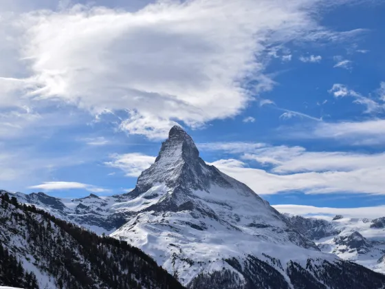 The Matterhorn's pyramidal peak rising above the Swiss Alps near Zermatt