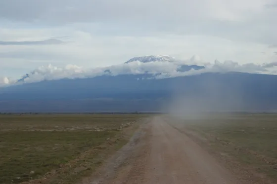 Mount Kilimanjaro's snow-capped summit rising above the savanna in Tanzania