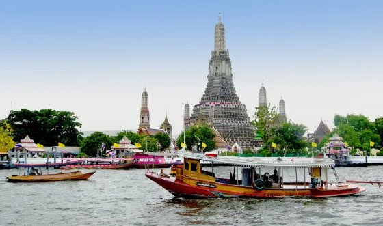 Wat Arun, the Temple of Dawn, seen across the Chao Phraya River in Bangkok, Thailand