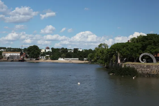 Low buildings and trees along the waterfront at Colonia del Sacramento, on the River Plate, Uruguay