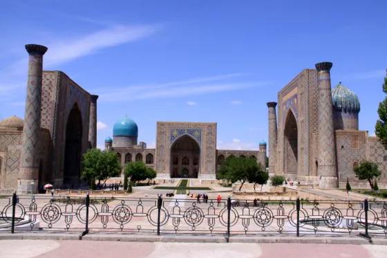 The tiled portals and turquoise domes of the three madrasas around the Registan square in Samarkand, Uzbekistan